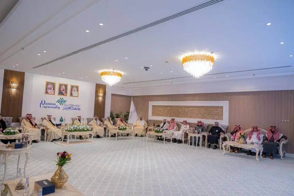 A group of people, called the Saudi Ghutra, Eqal and Bisht, gathered in a large ballroom in Qassim. The hall is lined with lamps, organizational boards, and the official university logo. Confirm their presence by looking for gene names, significance and location.