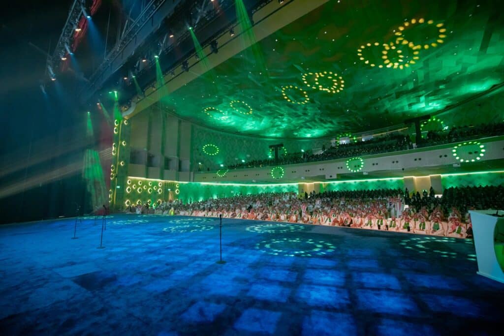 The 95th National Day celebration at Qassim University in a modern hall with a distinctive atmosphere and full attendance.