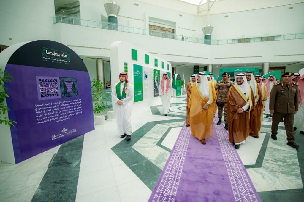 Official presence of the Emir of Qassim at the University of Qassim's 95th National Day celebration with the participation of university officials.