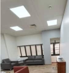 A modern office lobby at Qassim University designed for sustainable energy, suitable for academic meetings.