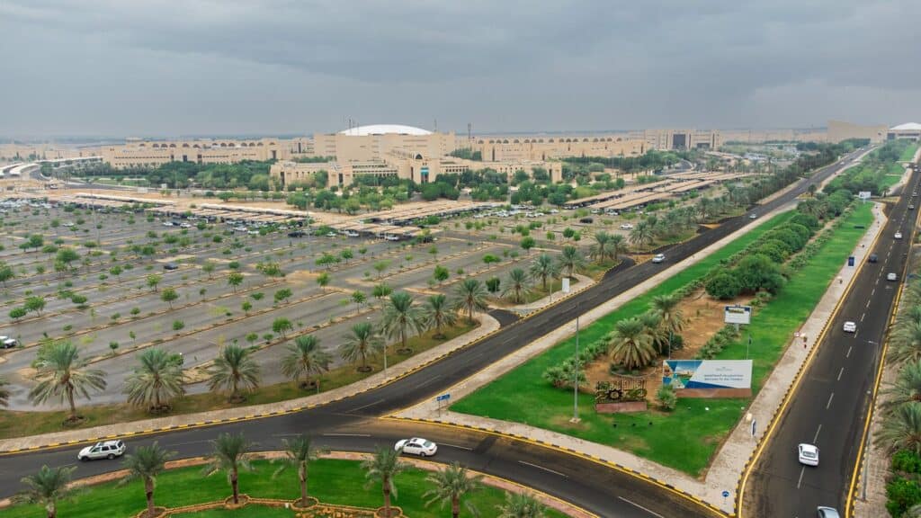 An aerial view of the Qassim University campus highlighting buildings and facilities in a Saudi academic environment.