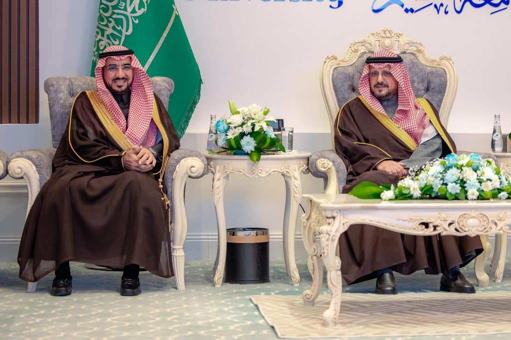 A discussion on the achievements of Qassim University under the patronage of the deputy emir of the region in a formal academic context.