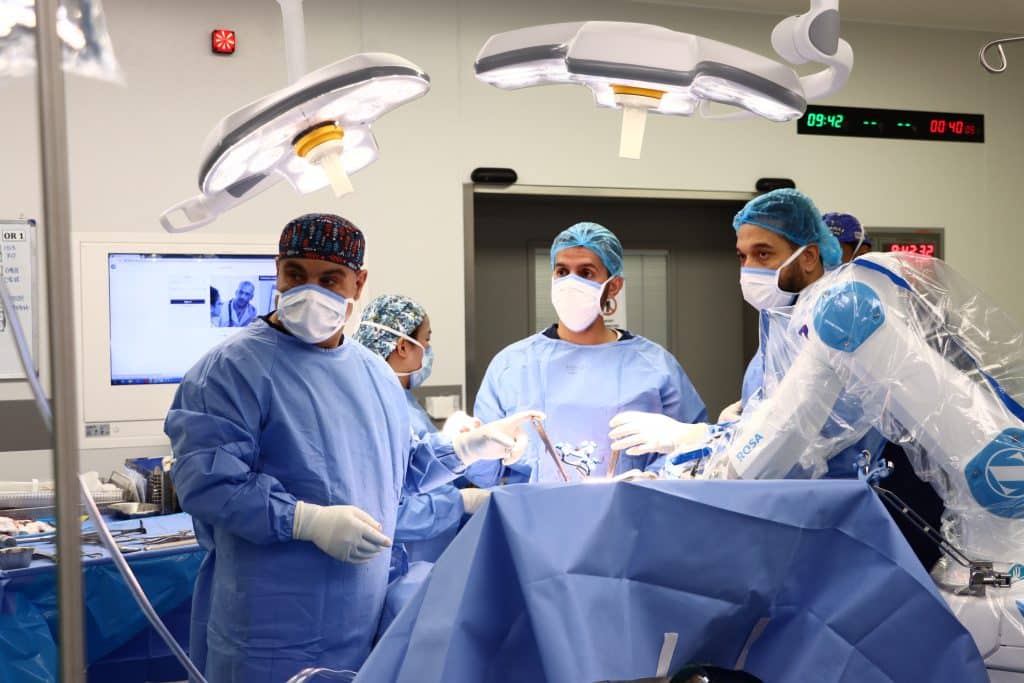A medical team at Qassim University performs a surgery in a state-of-the-art academy.