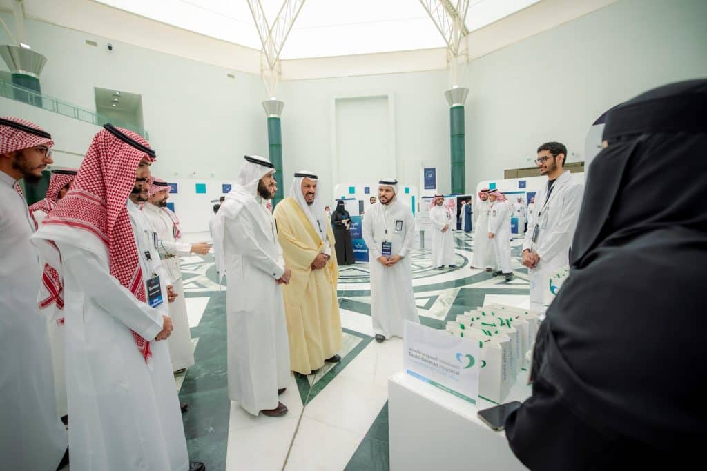 An academic event for the Faculty of Medicine at Qassim University in a modern hall in a welcoming atmosphere.