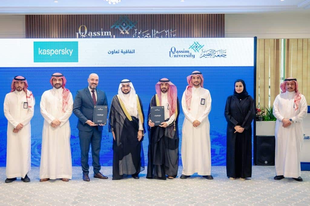 Representatives from Qassim University and Kaspersky at an academic event.