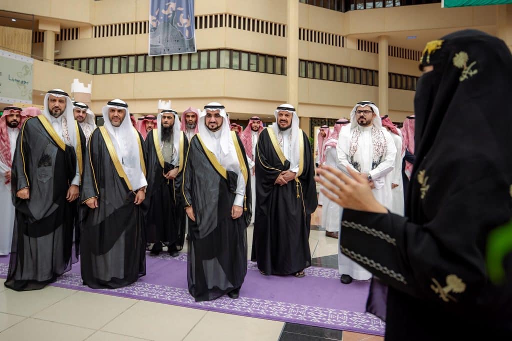 An official meeting at Qassim University in the presence of members to discuss the Badina Day event.