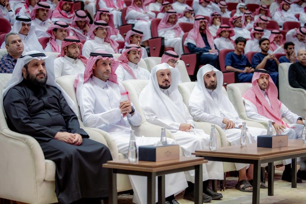 Academic presence at a Qassim University event, with official and organized arrangements.