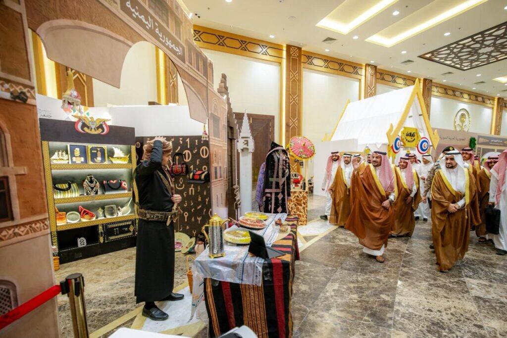 Students from Qassim University visit the Peoples' Festival exhibition to learn about local crafts and heritage.