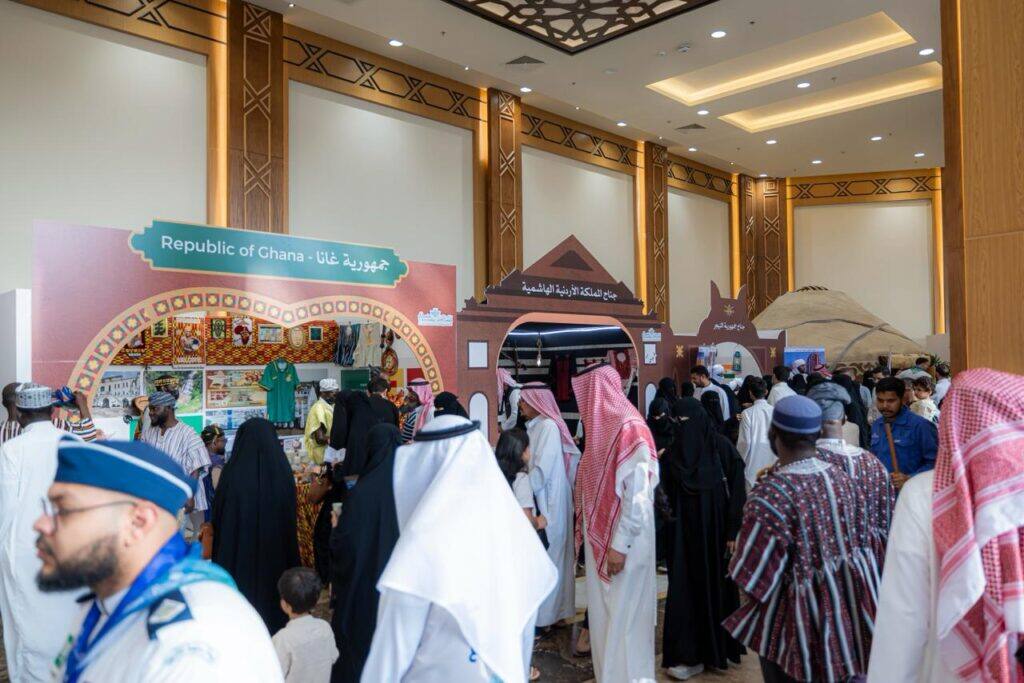 Visitors at Qassim University hall are viewing cultural exhibits as part of an academic event.