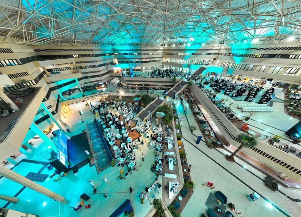 A modern hall at Qassim University hosts meetings between innovators and national entities to promote research and development.