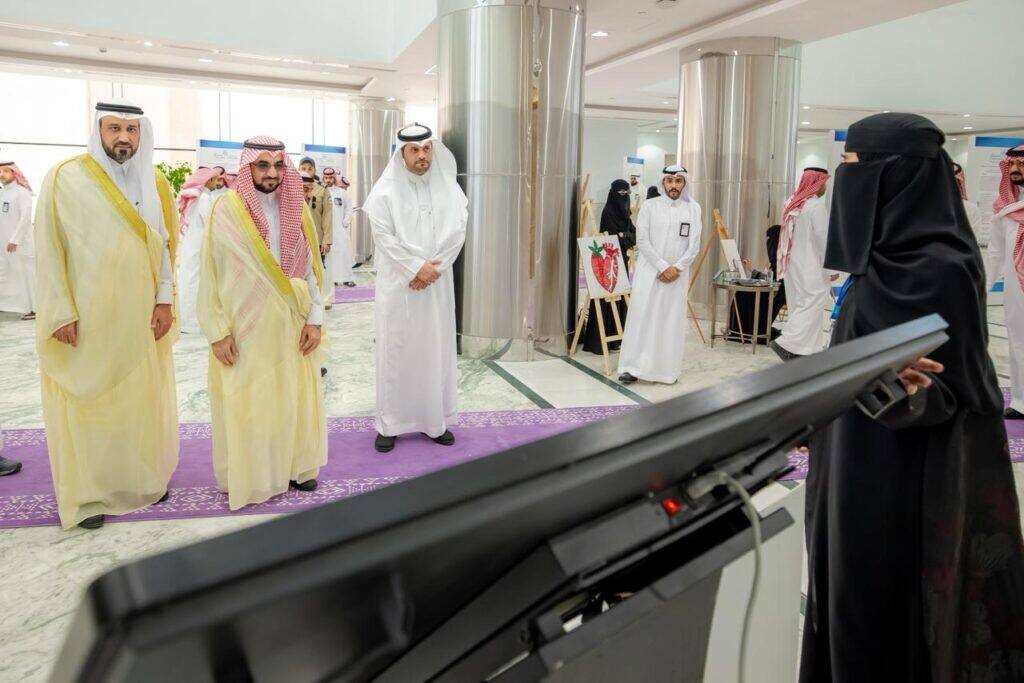 Academic presentation on agriculture and food for a delegation from Qassim University in a modern hall.