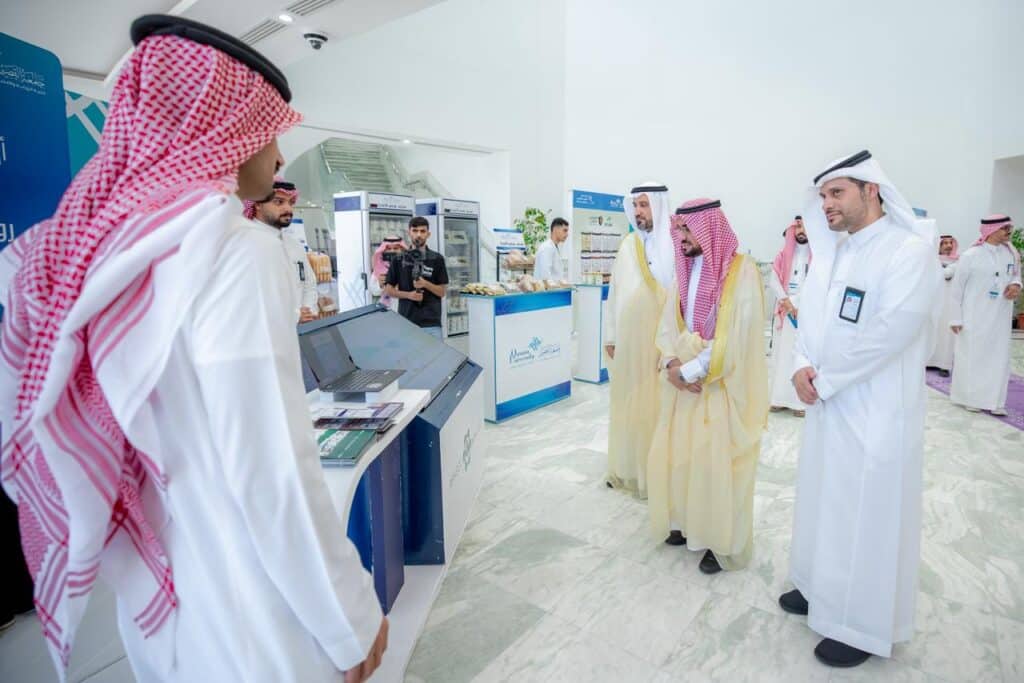 Academic discussion at the research forum of the College of Agriculture, Qassim University, on sustainability.